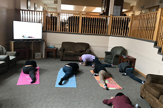 Youth and staff doing yoga