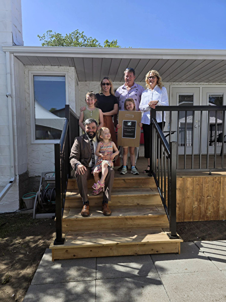 Greg with family on steps