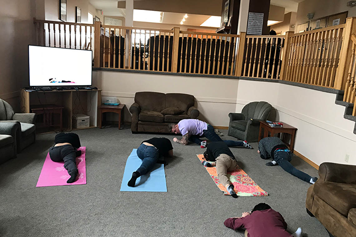 Youth and staff doing yoga